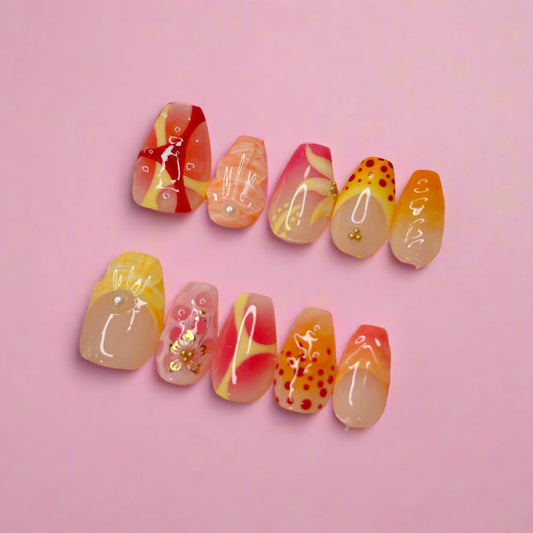 set of 10 colorful press on nails, with floral and shells paintings and 3D art, using pink, yellow, orange and red colors