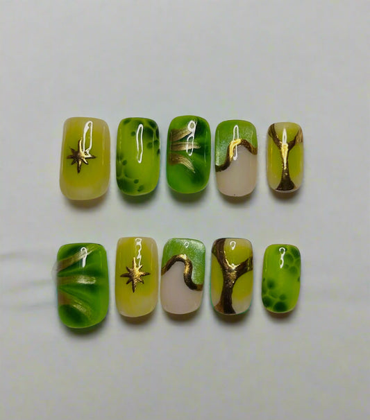 set of 10 press on nails in green and beige with gold accents and blooming designs